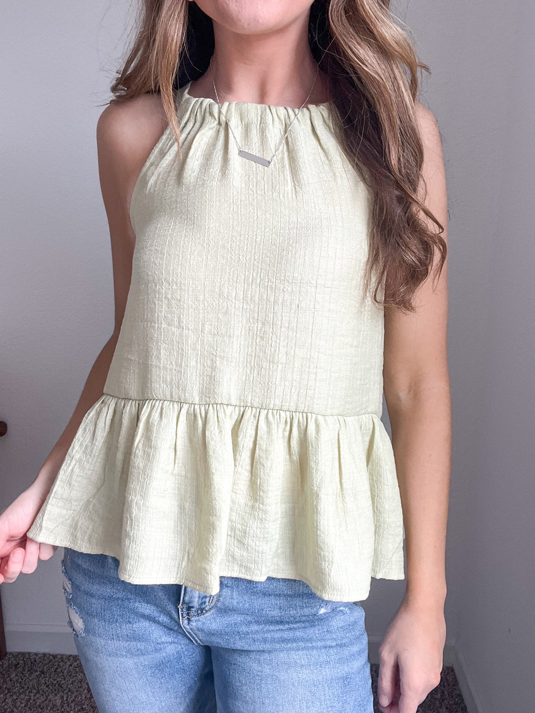 Colleen Back Tie Ruffle Hem Sleeveless Top